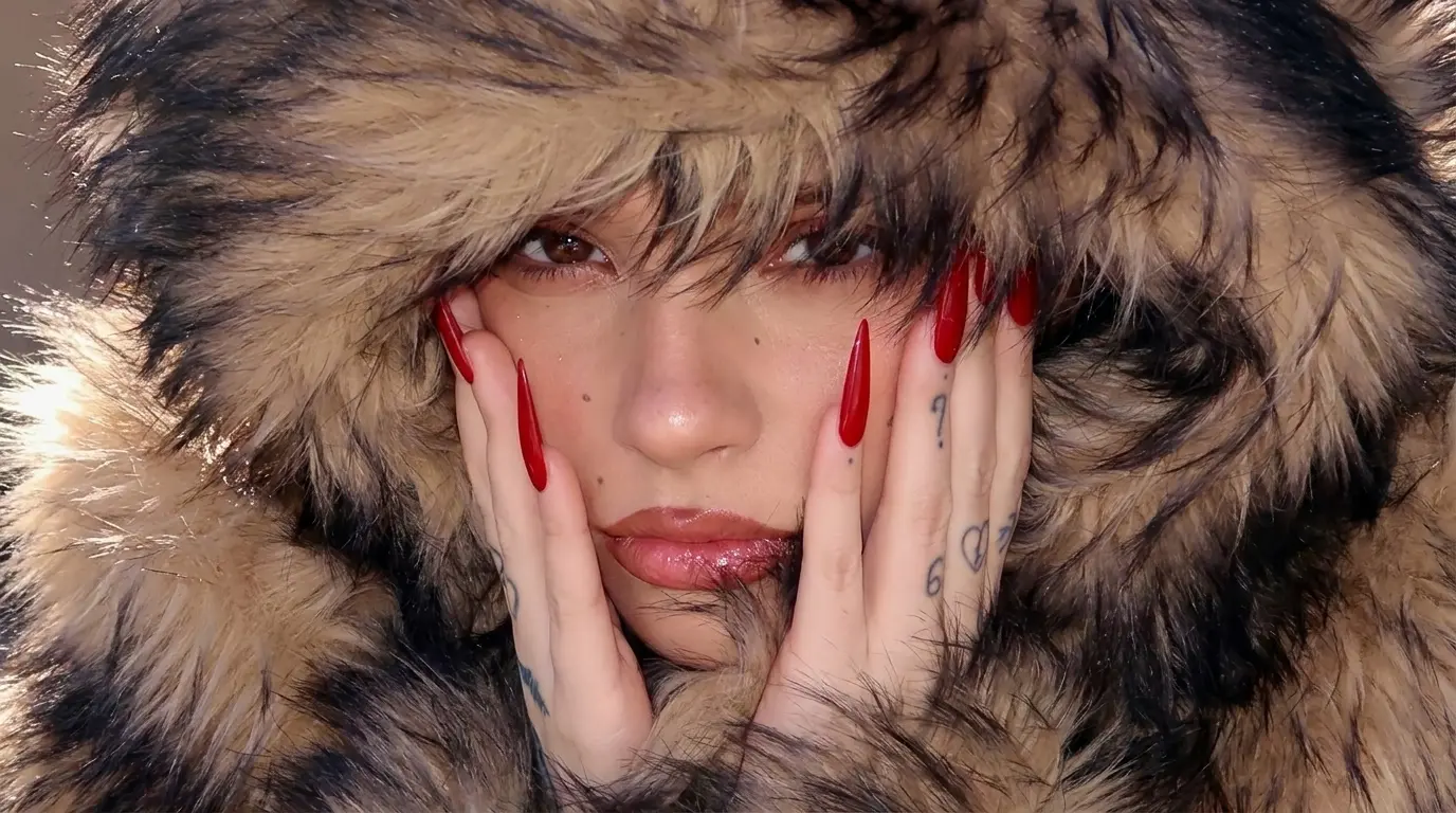 Close-up of a woman wearing a brown and black faux fur hooded jacket