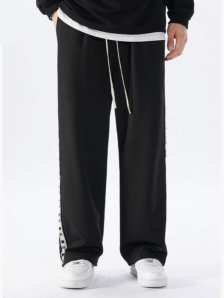 Pantalon droit à empiècements latéraux en sangle