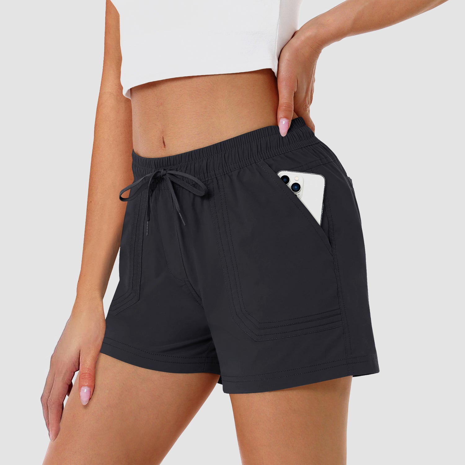 Short de course pour femme, idéal pour la salle de sport, séchage rapide, coupe décontractée et 2 poches.