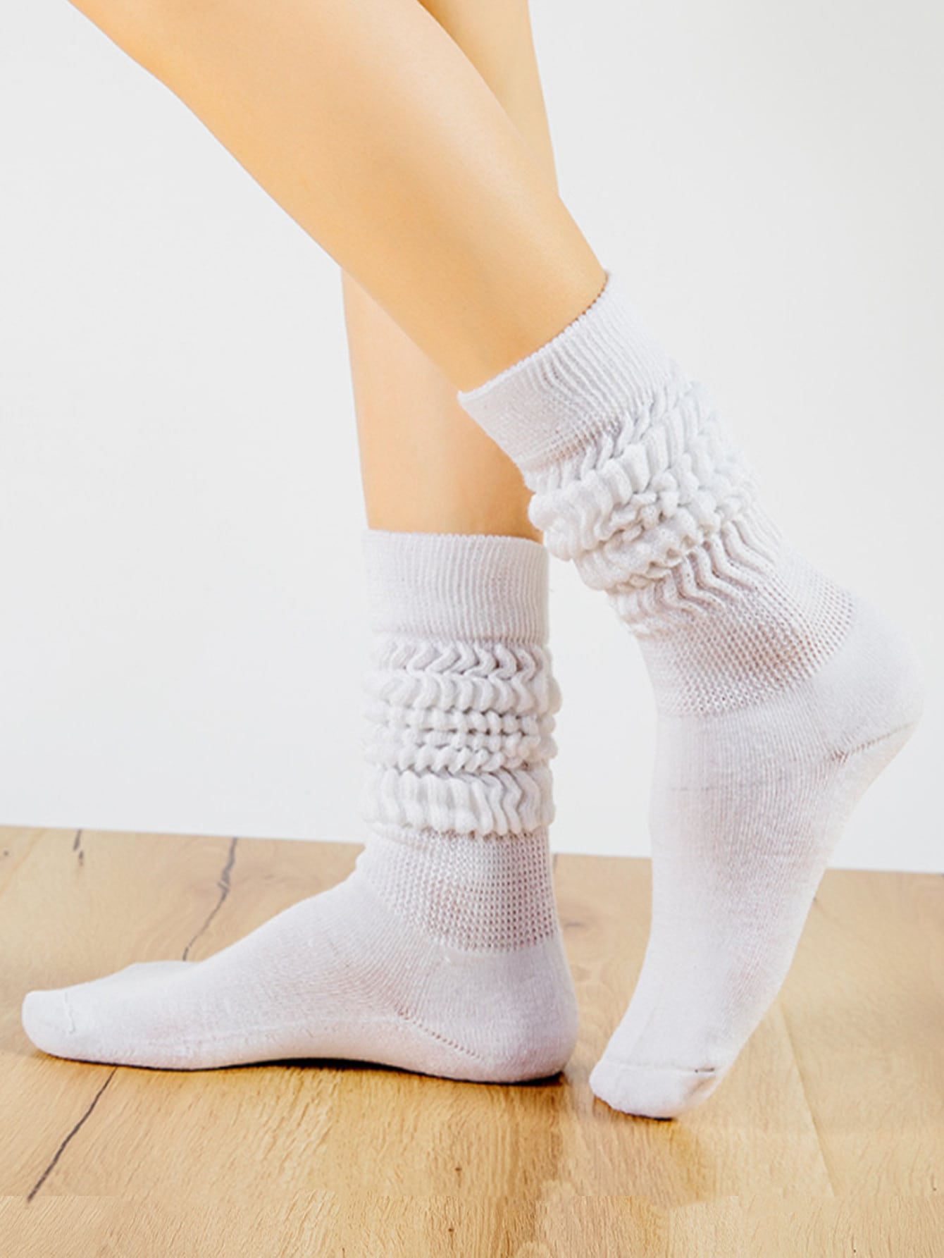 1 paire de chaussettes mi-mollet unies