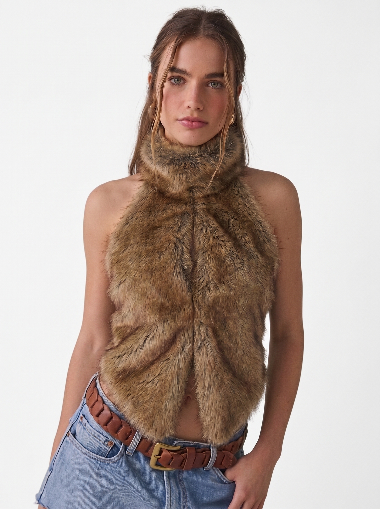 Woman wearing a brown faux fur halter vest, front view