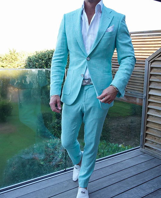 Ensemble blazer et pantalon 2 pièces à revers cranté et poches, style classique.