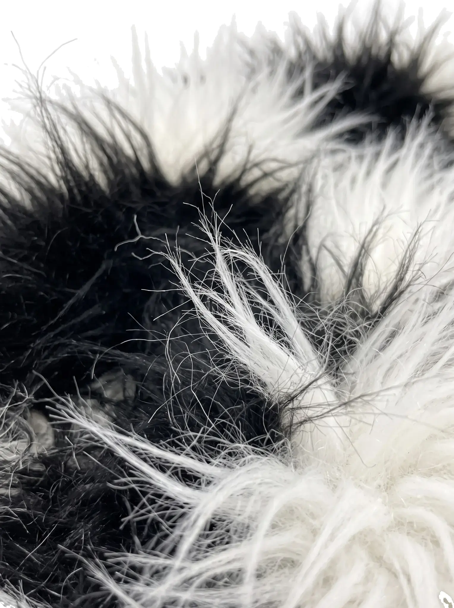 Close-up of the spotted black and white faux fur texture