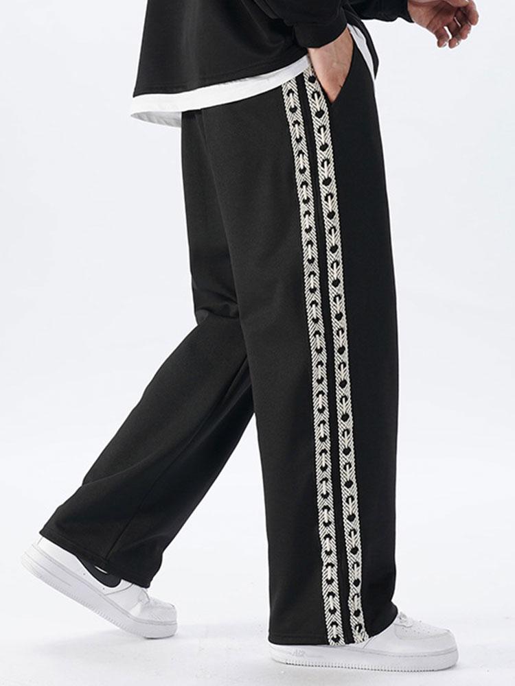 Pantalon droit à empiècements latéraux en sangle