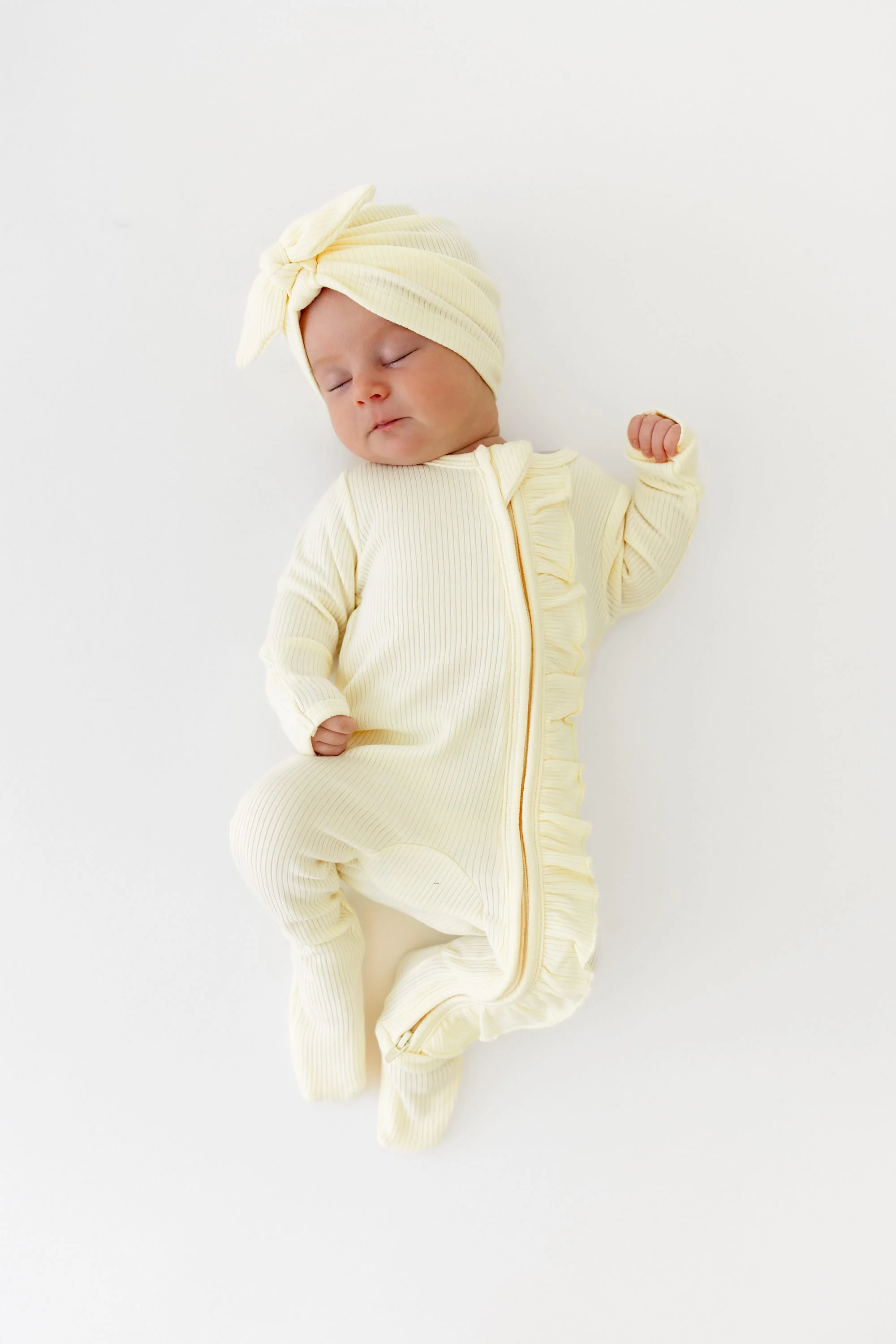 Ribbed Ruffle Zipper Footie in Chamomile