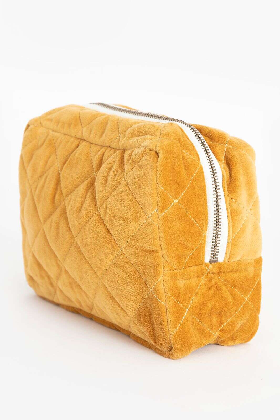 Donkergele velvet toilettas