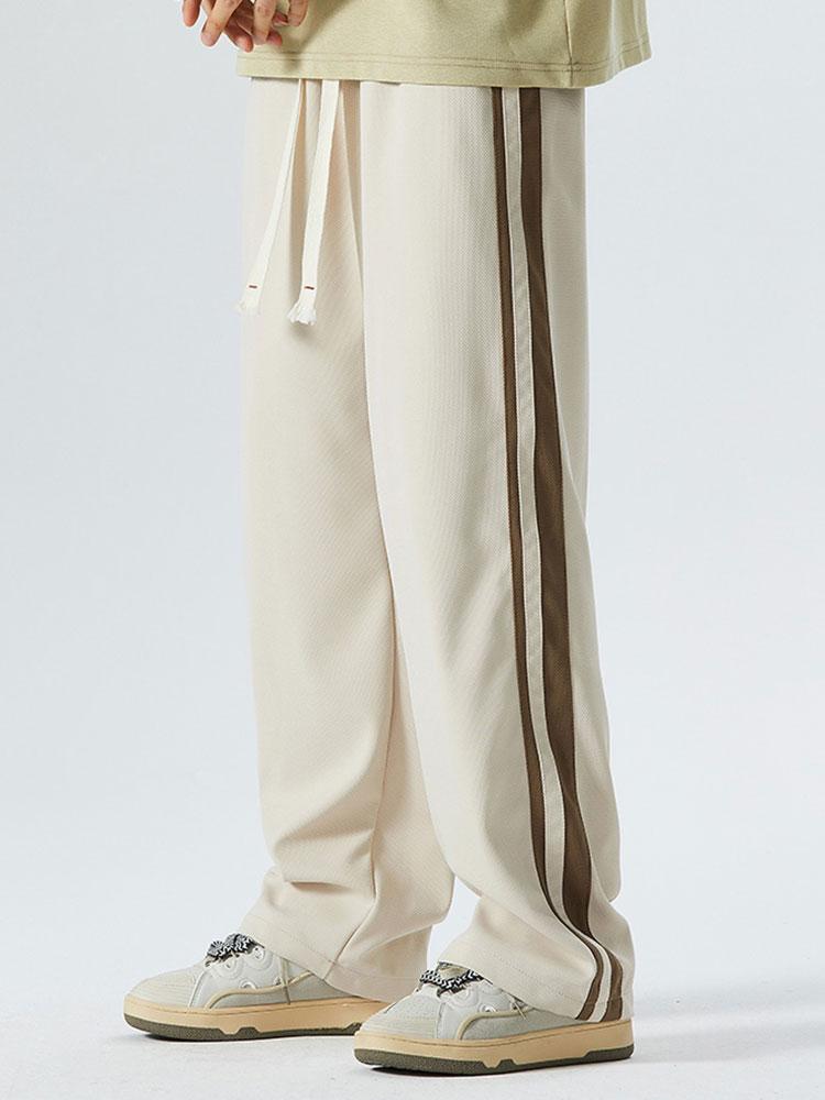 Pantalon vintage à rayures latérales, coupe ample et jambes droites