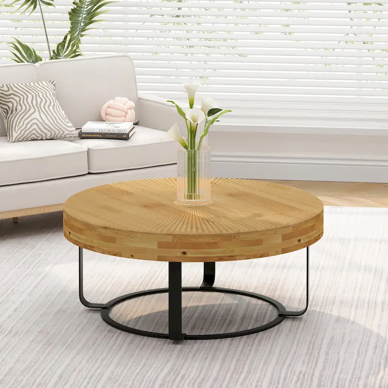 Contemporary Round Wooden Coffee Table with Intricate Carving and Metal Legs