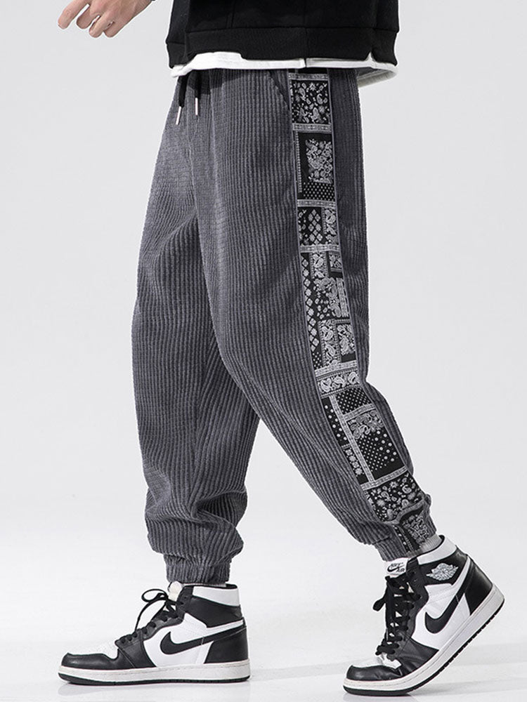 Pantalon à empiècements en velours côtelé imprimé cachemire