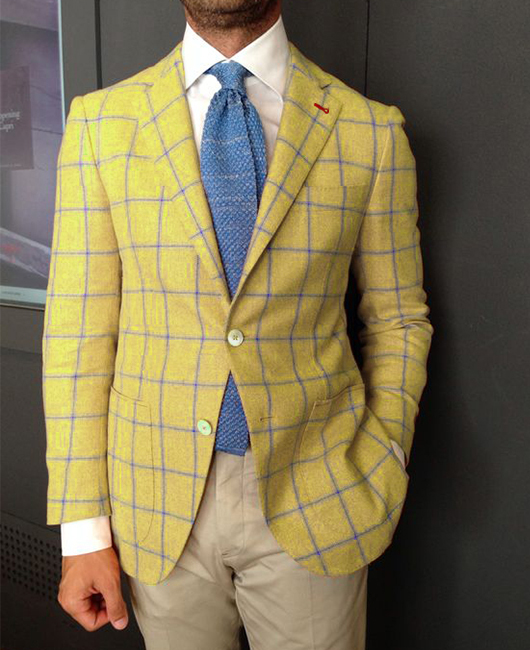 Blazer décontracté à carreaux orange, revers cranté et deux boutons.